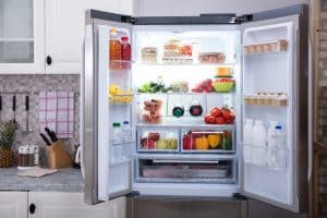 Open Refrigerator Filled With Fresh Fruits And Vegetables